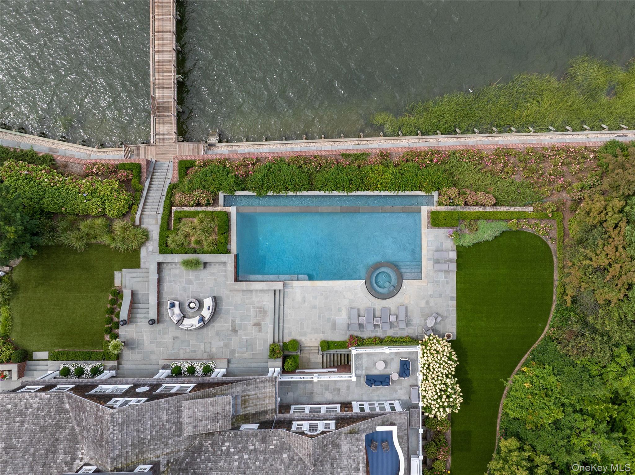 75 Cove Neck Road Cove Neck, NY 11771 - Photo 40 of 40 an aerial view of a house with a garden and lake view