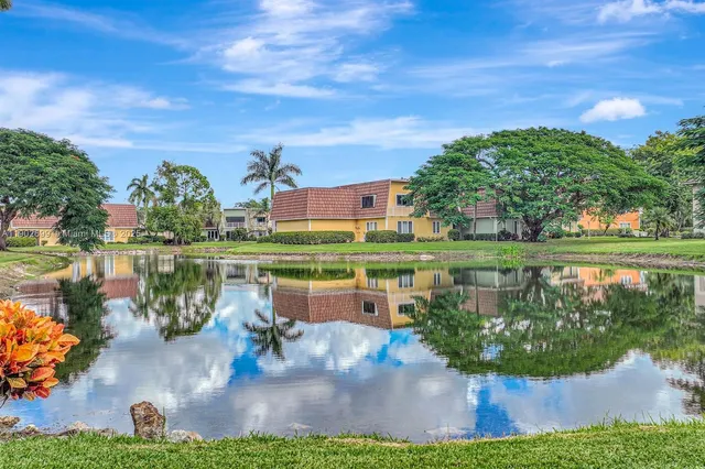 a view of a lake with a houses in the back