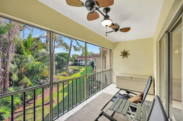 a view of a balcony with furniture