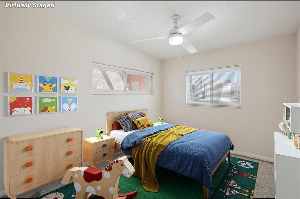 16016 4th Street East Redington Beach, FL 33708 - Photo 11 of 29 a bedroom with a bed and a window