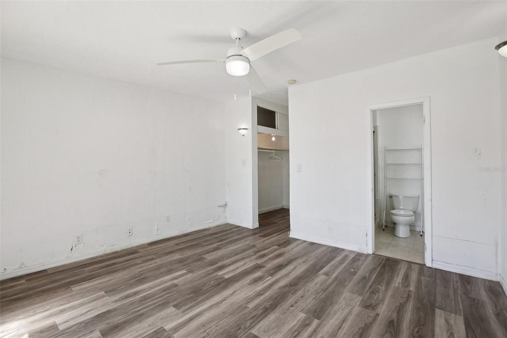 16016 4th Street East Redington Beach, FL 33708 - Photo 18 of 29 wooden floor in an empty room