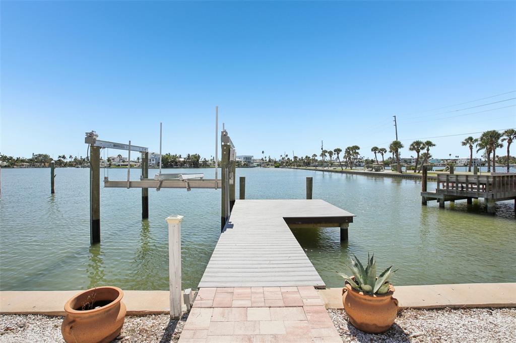 16016 4th Street East Redington Beach, FL 33708 - Photo 26 of 29 a wooden deck with lake view