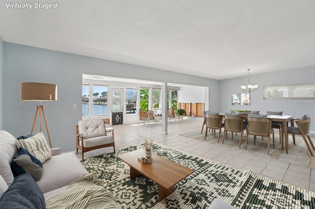 16016 4th Street East Redington Beach, FL 33708 - Photo 5 of 29 a living room with furniture and a large window