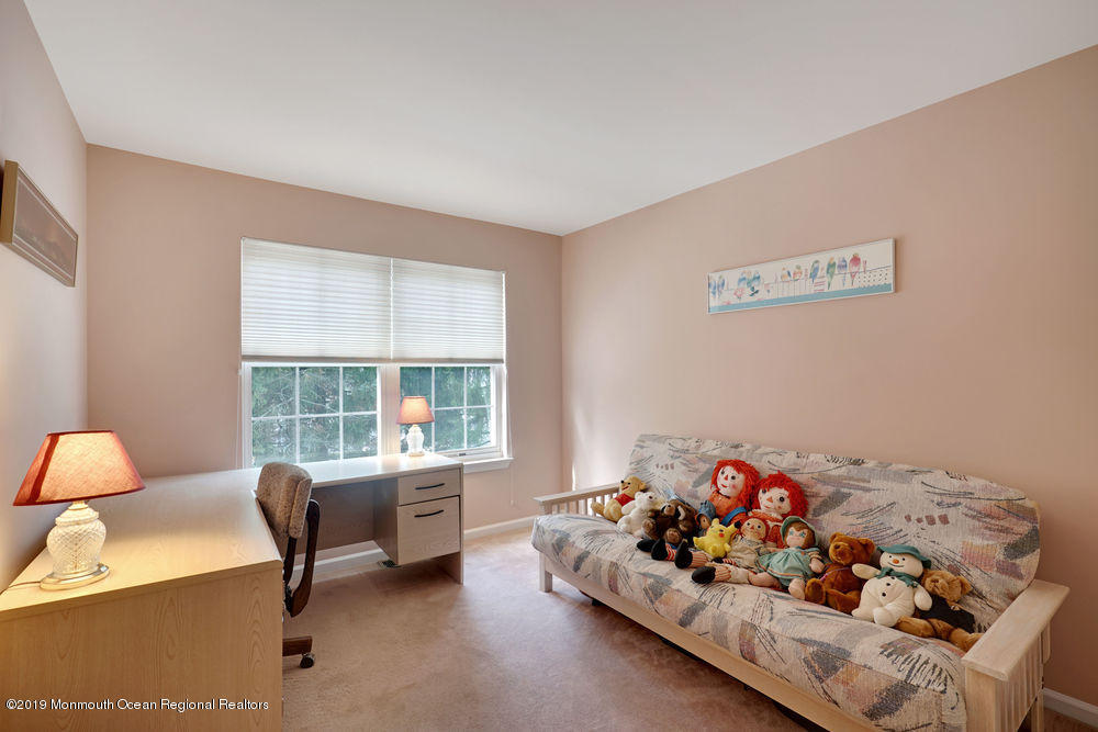 8 Bristel Road Holmdel, NJ 07733 - Photo 22 of 30 a livingroom with toys and a couch