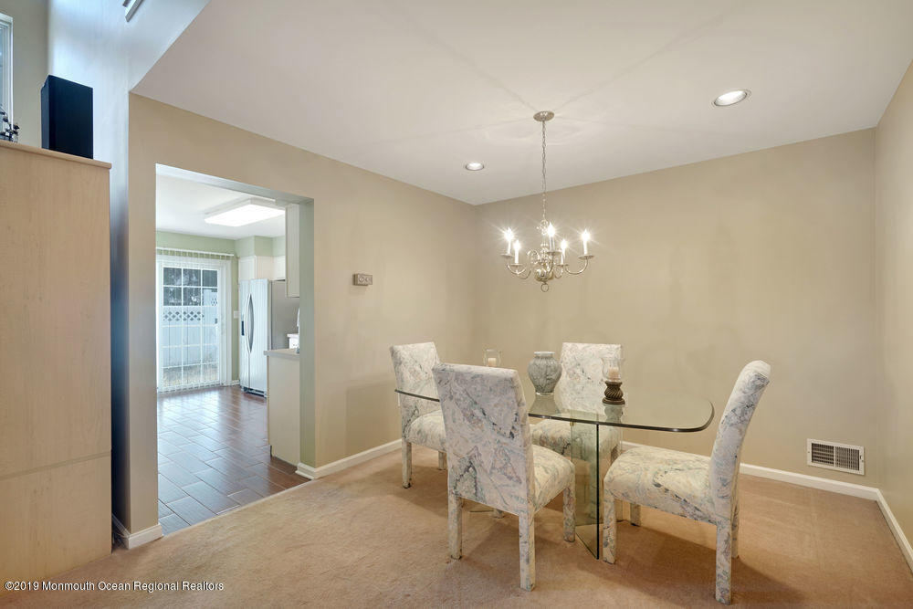 8 Bristel Road Holmdel, NJ 07733 - Photo 5 of 30 a view of a dining room with furniture and wooden floor