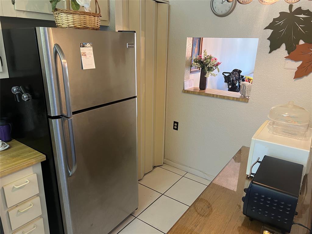 10100 Northwest 30th Court, Unit 310 Sunrise, FL 33322 - Photo 16 of 60 a view of kitchen with refrigerator and window