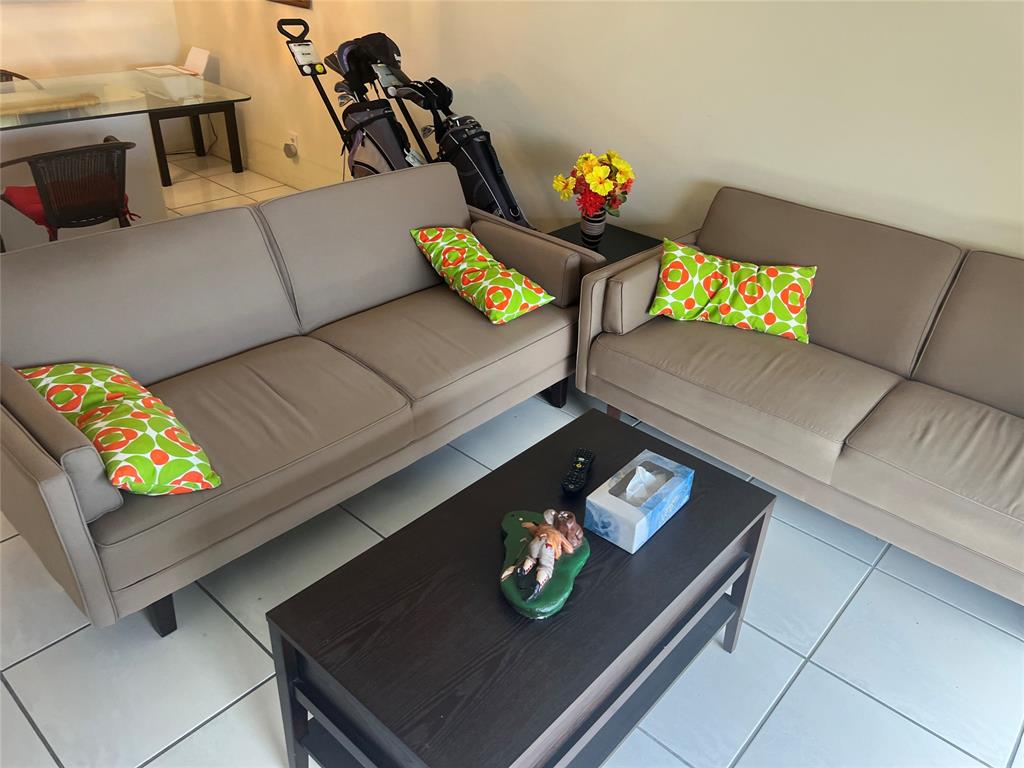 10100 Northwest 30th Court, Unit 310 Sunrise, FL 33322 - Photo 23 of 60 a view of a living room with furniture and a couch