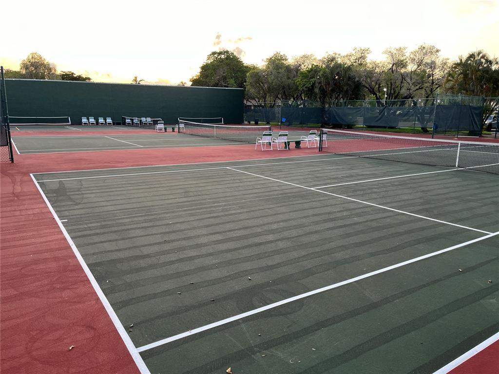 10100 Northwest 30th Court, Unit 310 Sunrise, FL 33322 - Photo 56 of 60 a view of a tennis court