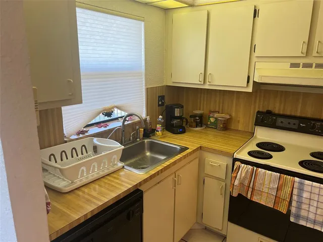 a living room with chairs and a couch