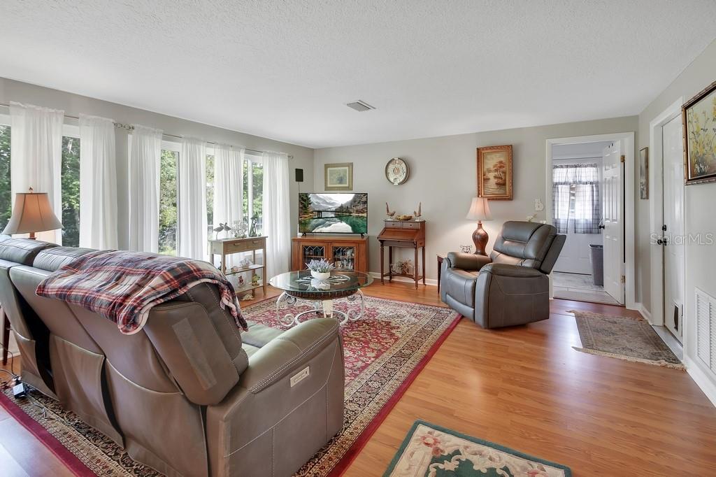 50 Bonita Road DeBary, FL 32713 - Photo 10 of 43 a living room with furniture fireplace and a window