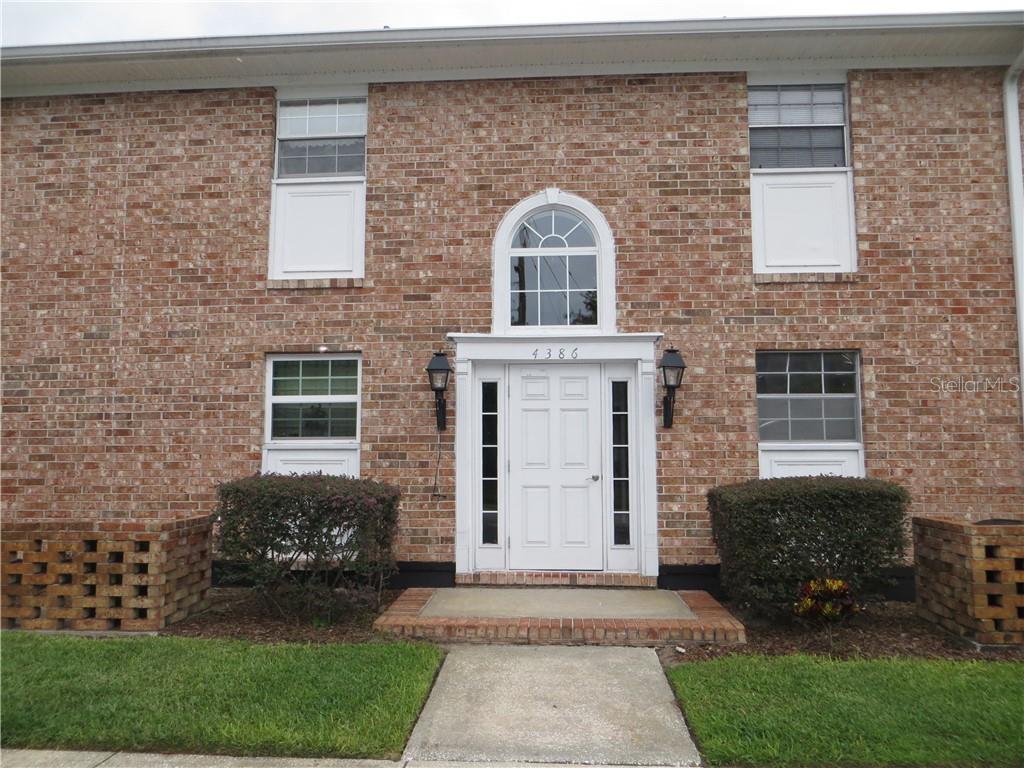 4386 Lake Underhill Road, Unit B Orlando, FL 32803 - Photo 1 of 1 a front view of a house with a garden