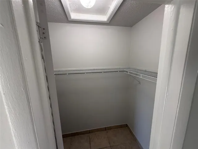 a view of an empty walk in closet