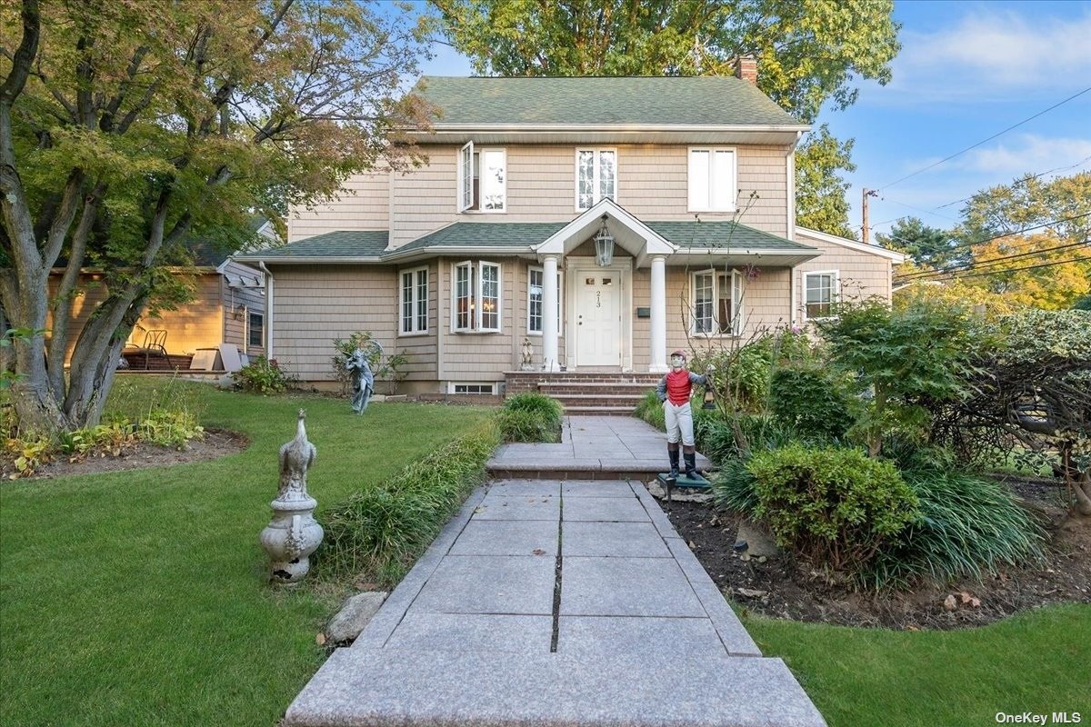 213 Garden Street Great Neck, NY 11021 - Photo 1 of 1 a front view of a house with garden