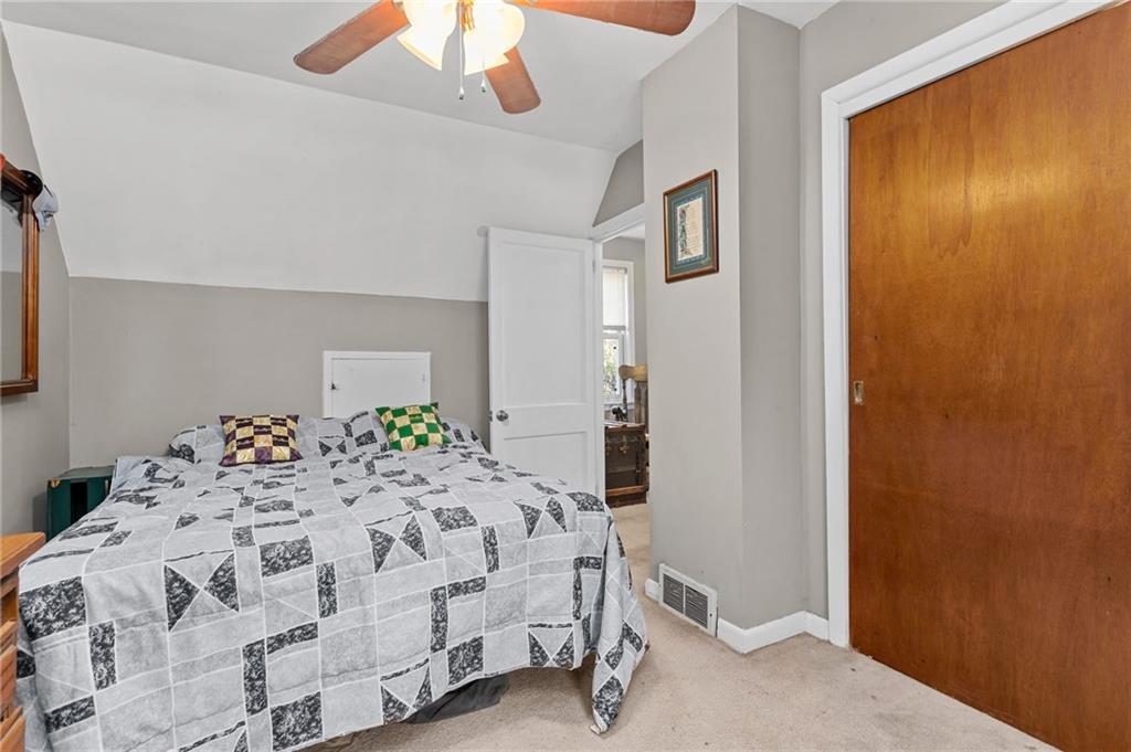 745 Park Quarry Road Freedom, PA 15042 - Photo 18 of 22 a bedroom with a bed and a chandelier