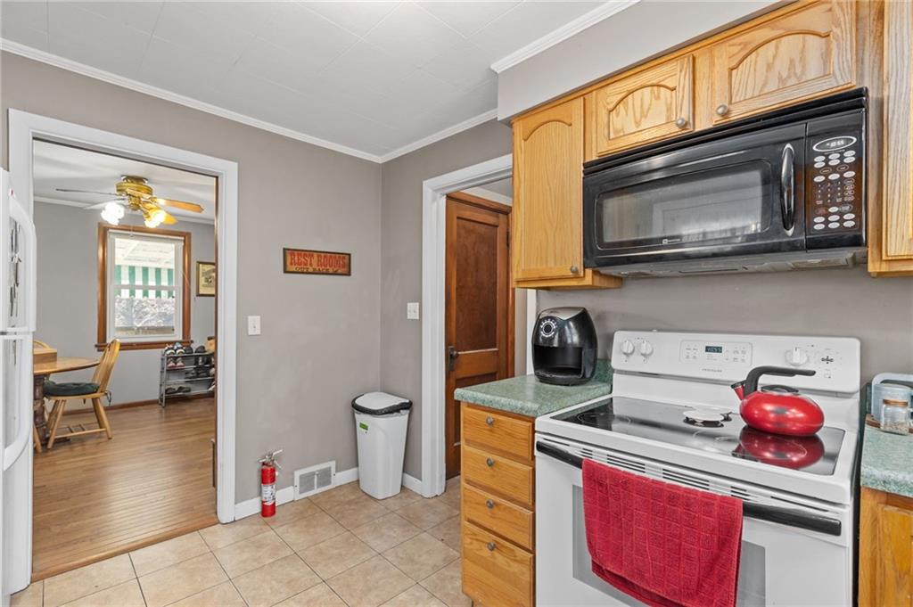 745 Park Quarry Road Freedom, PA 15042 - Photo 7 of 22 a kitchen with a stove a microwave and refrigerator