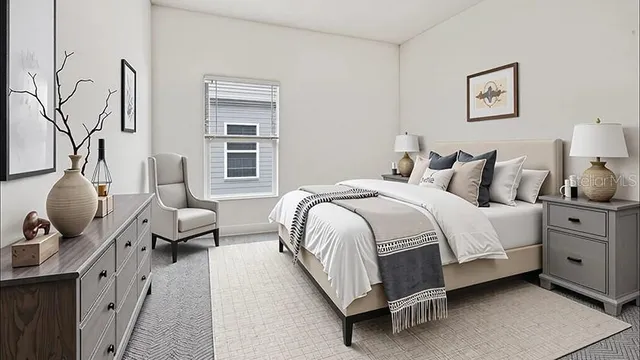 a bedroom with bed and window