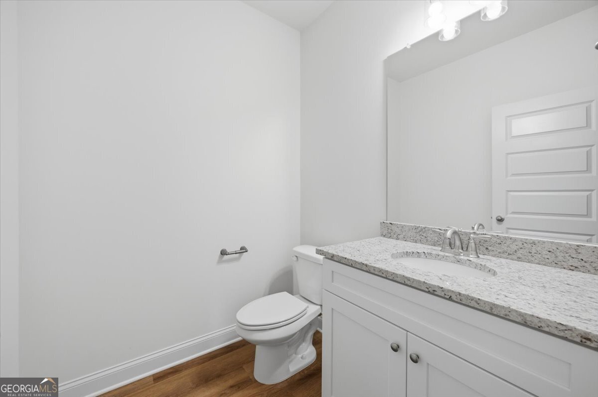 2778 Boxankle Road Forsyth, GA 31029 - Photo 4 of 21 a bathroom with a granite countertop toilet and a sink