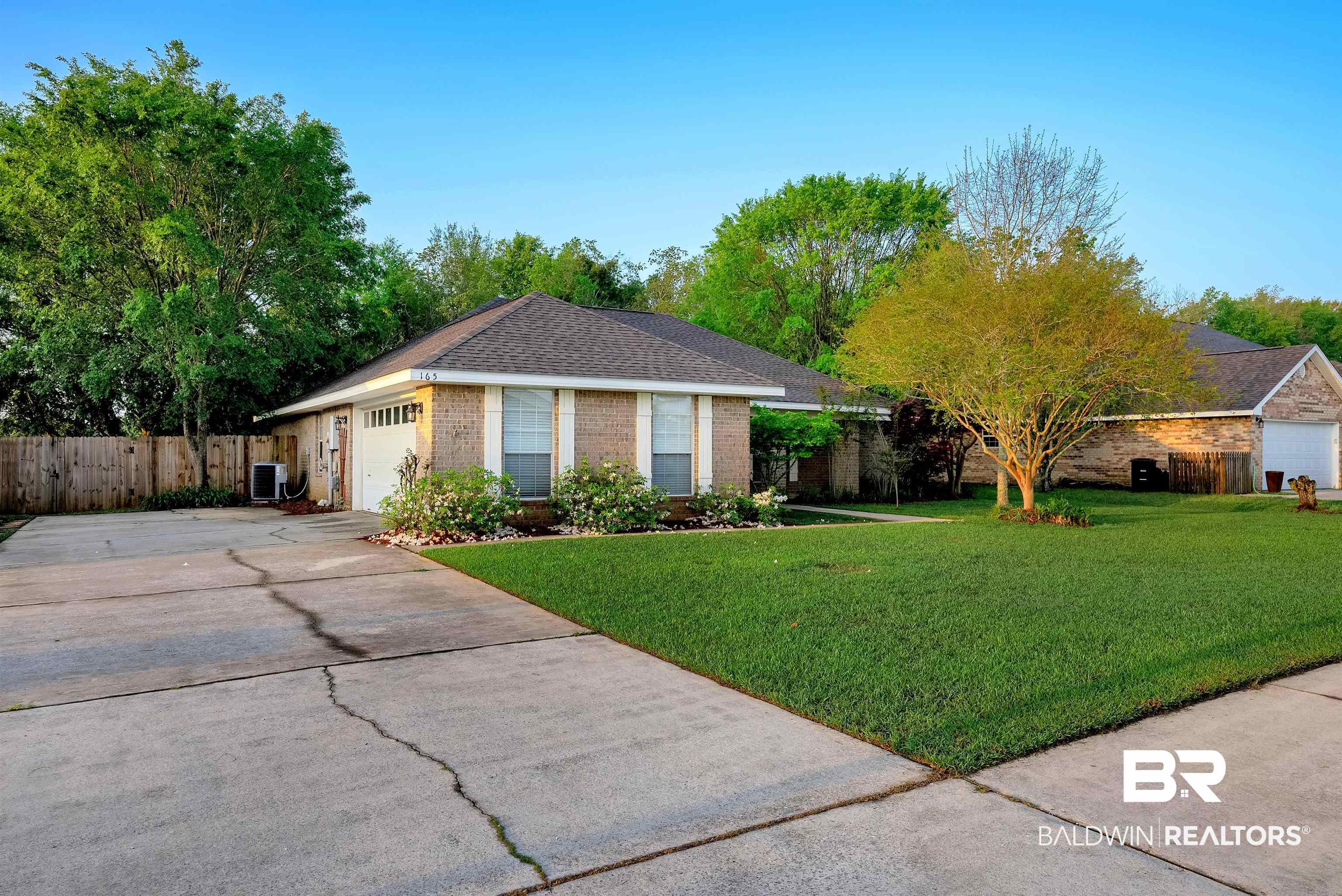 165 Pemberton Loop Fairhope, AL 36532 - Photo 25 of 25 Single story home with fence, a garage, central AC, brick siding, and a front lawn