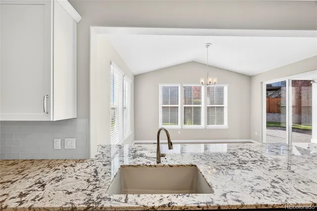 a view of a kitchen with a sink