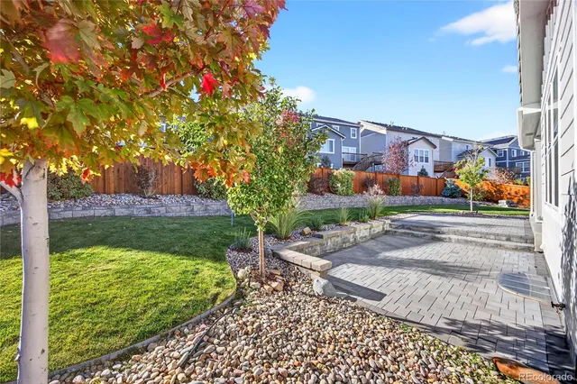 a view of kitchen with granite countertop cabinets and outdoor space