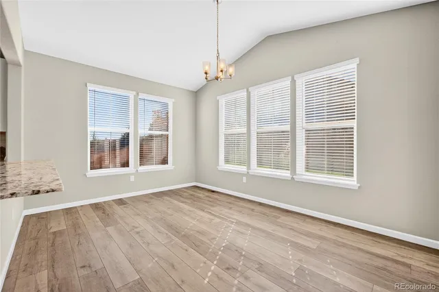 a view of empty room with a fireplace