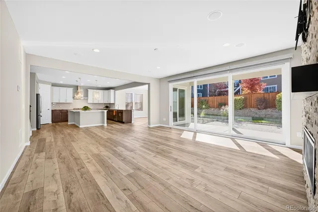 a view of a house with a backyard and a garage