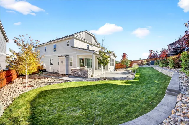 a view of a house with a porch and sitting area