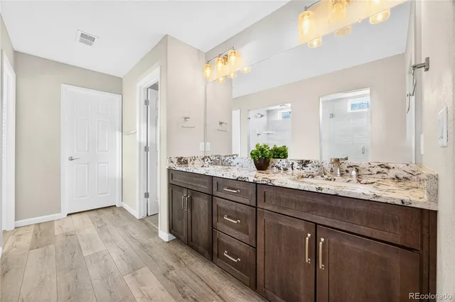 a bathroom with a glass shower door