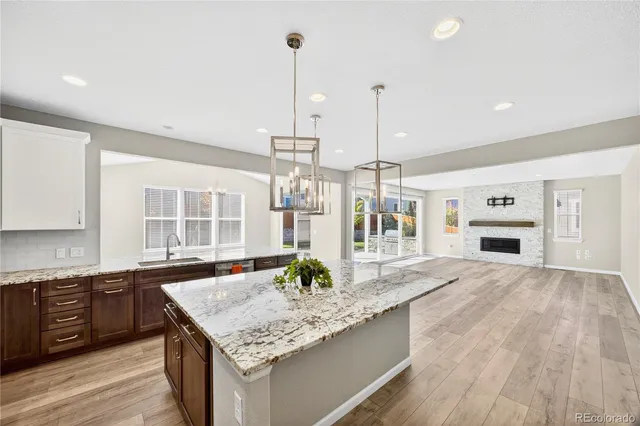 a kitchen with stainless steel appliances granite countertop a sink and oven