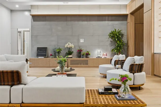 a living room with furniture and a potted plant