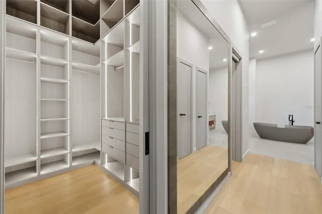 a bathroom with a tub and shower