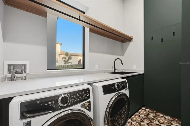 a utility room with dryer and washer