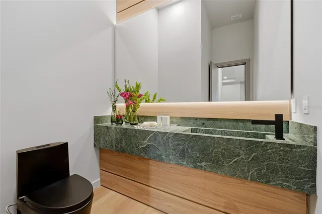 a living room with a couch and potted plant