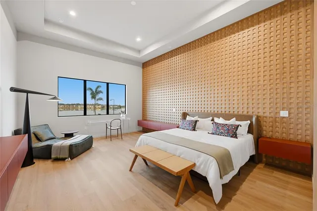 a bedroom with a bed and a couch