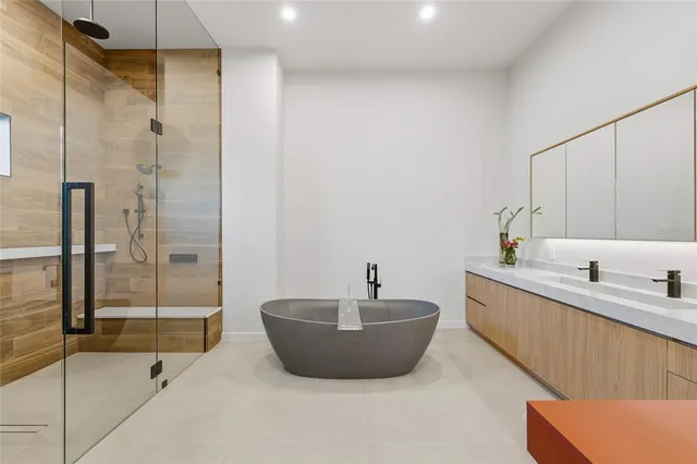 a spacious bathroom with a tub and shower