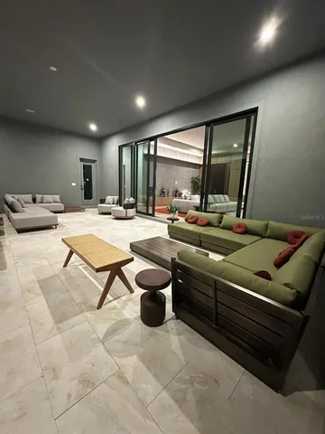 a view of a dining room with furniture and window