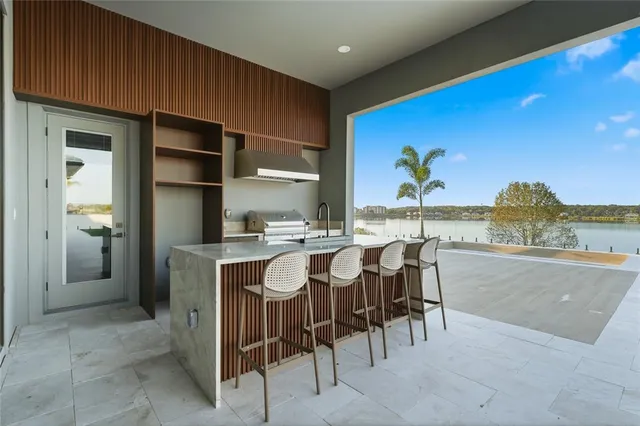 a view of swimming pool with seating space