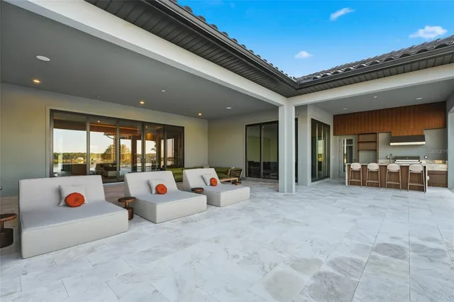 a view of swimming pool having outdoor seating