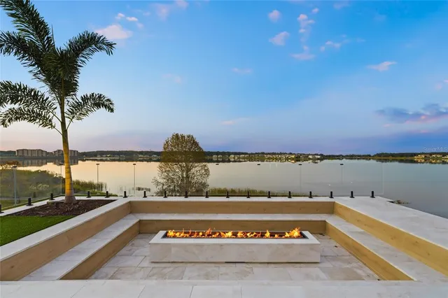 an aerial view of a city with lots of residential buildings lake and ocean view