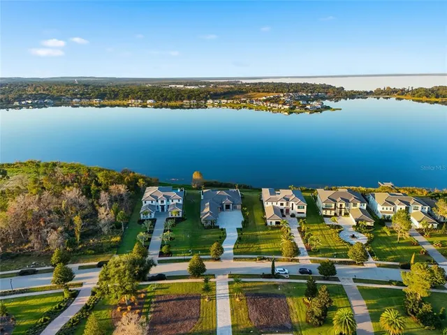 a view of house with a yard