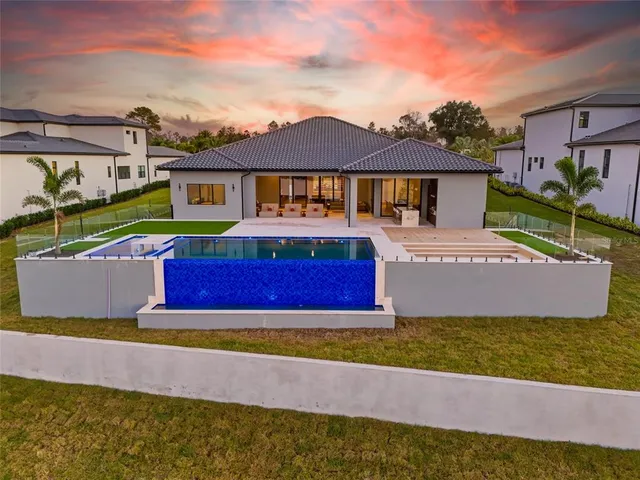 an aerial view of a city with lawn chairs