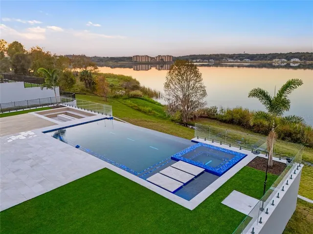 a view of a swimming pool with a patio