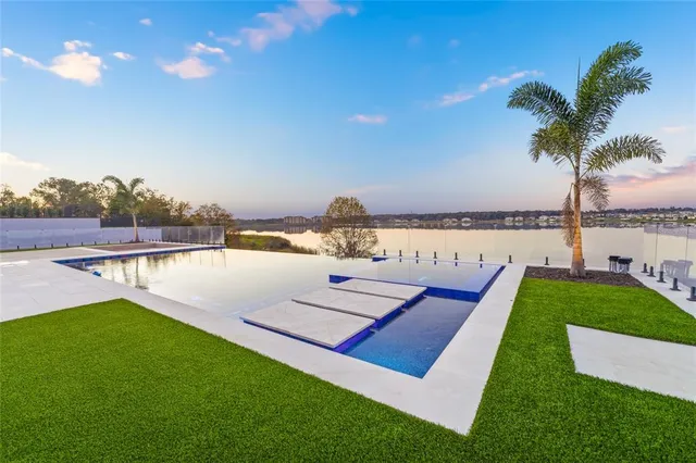 a view of swimming pool with a lake view and mountain view