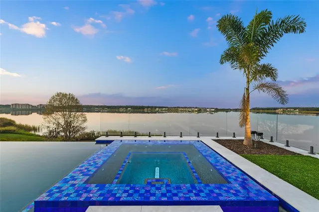 a view of a house with pool table and chairs