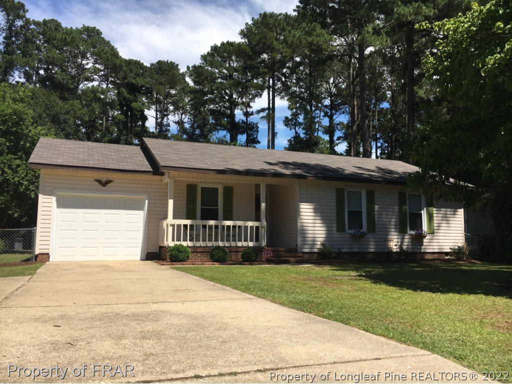 1733 Rim Road Fayetteville, NC 28314 - Photo 1 of 23 a front view of a house with a yard