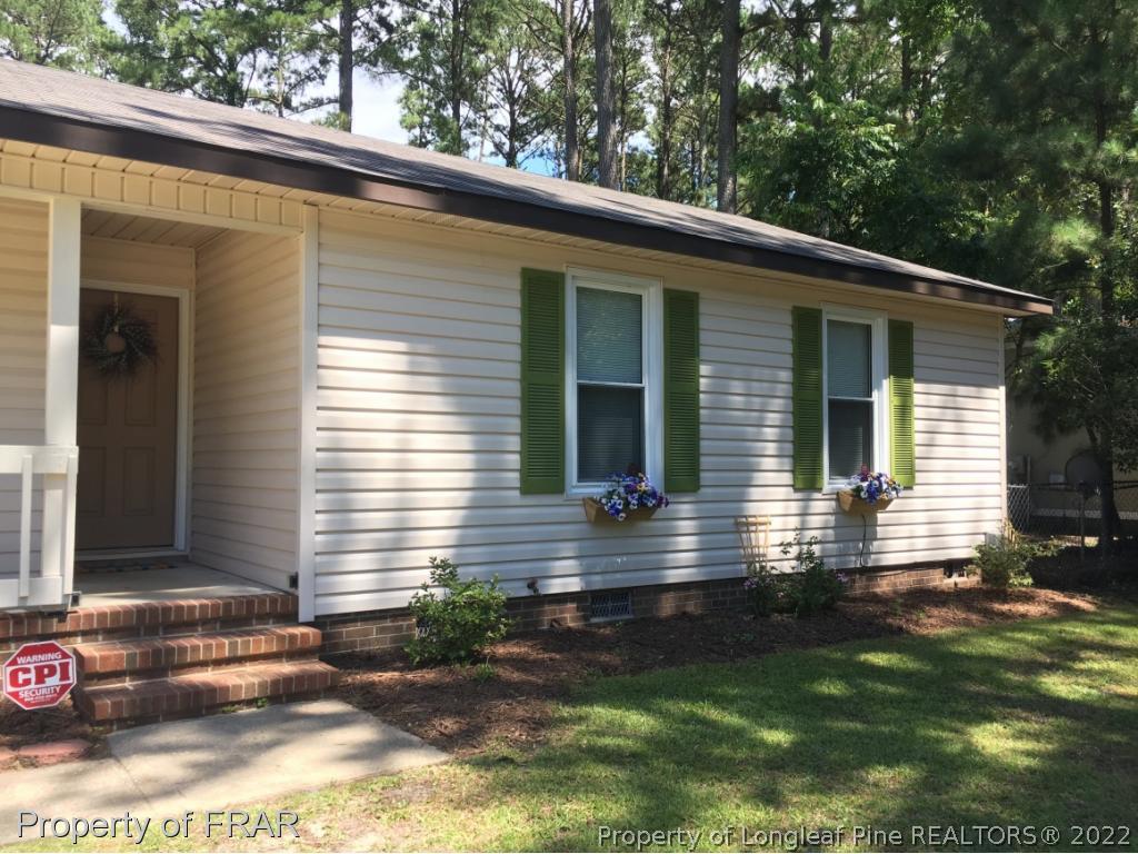 1733 Rim Road Fayetteville, NC 28314 - Photo 2 of 23 a view of house with backyard
