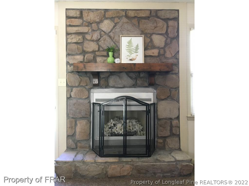 1733 Rim Road Fayetteville, NC 28314 - Photo 6 of 23 a living room with a fireplace