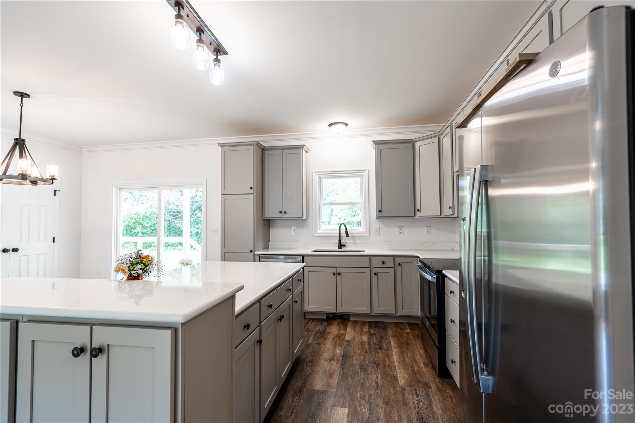 85 Rocky Lane Road Clyde, NC 28721 - Photo 11 of 37 a kitchen with a sink window and refrigerator