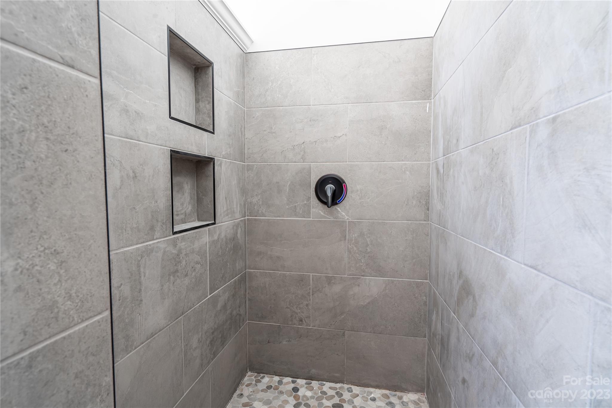 85 Rocky Lane Road Clyde, NC 28721 - Photo 21 of 37 a bathroom with a shower