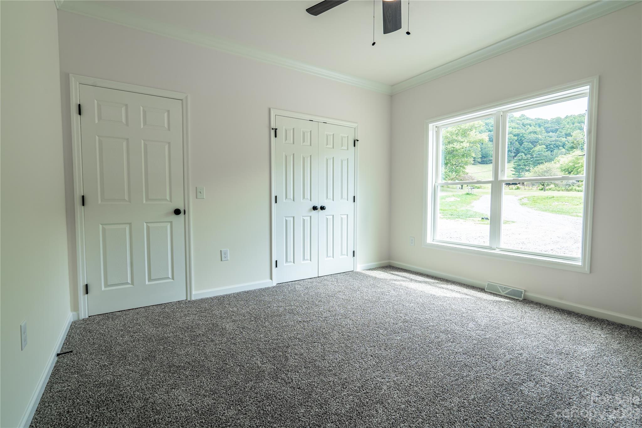85 Rocky Lane Road Clyde, NC 28721 - Photo 24 of 37 a view of an empty room with a window